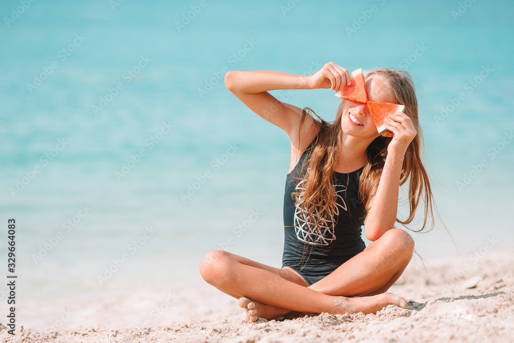 Cute little girl at beach during summer vacation Cute little girl at beach during summer vacation