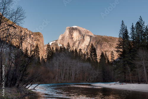 two hikers resting on a sandbar in Yosemite national park