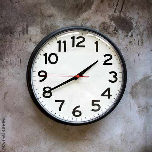 Clock on a Concrete Background