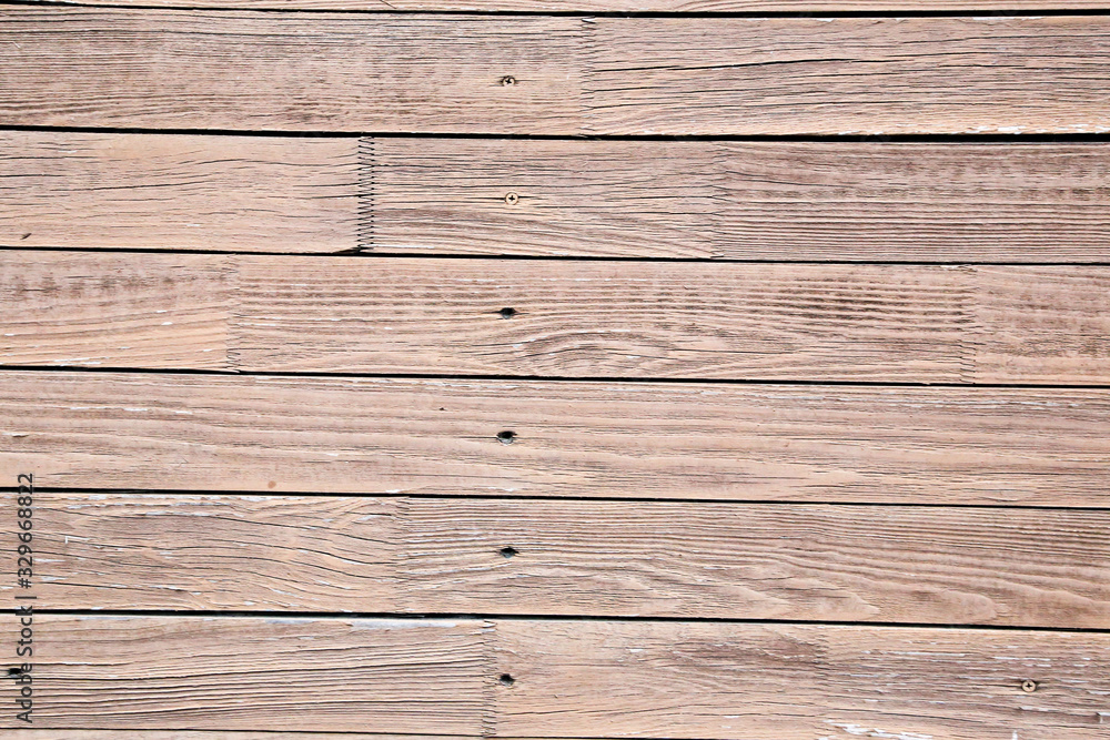 Fototapeta premium Old painted wooden fence. Background texture.