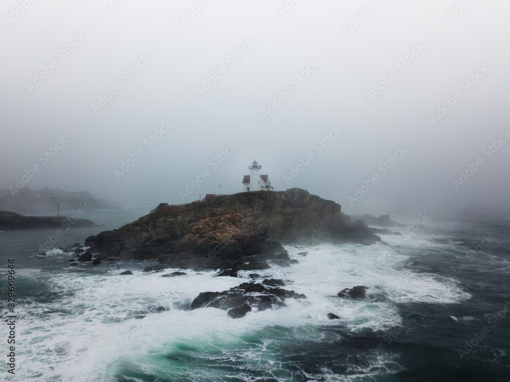 Fog Covered Lighthouse on the Coast of Maine