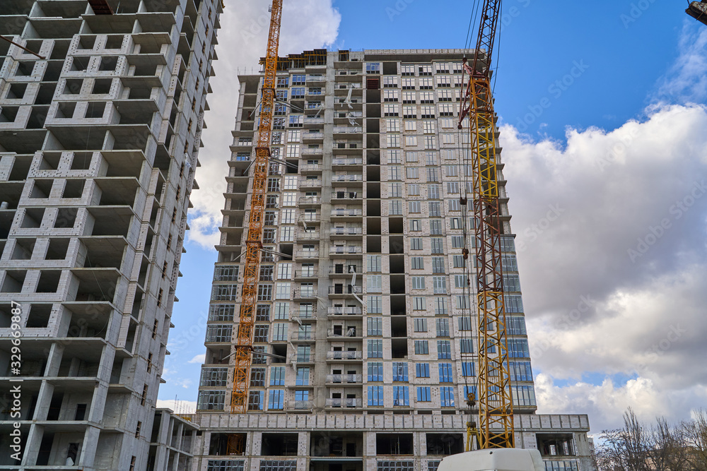 Construction site. High rise Building under construction. Construction of high-rise residential building