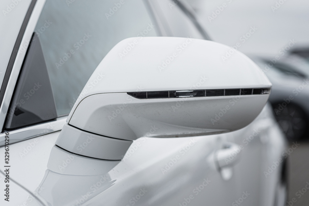 a side mirror of a modern car, outside a side mirror of a modern car, outside