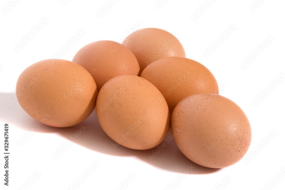 A studio photograph of half a dozen hen's eggs A studio photograph of half a dozen hen's eggs
