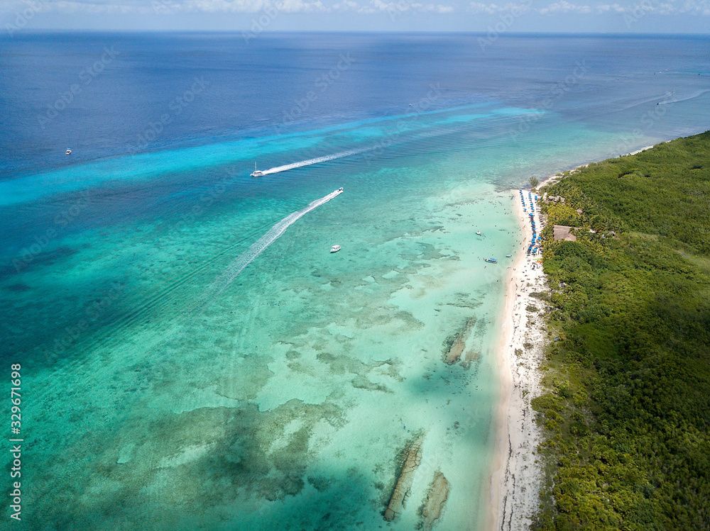 aerial view of the incredible colors of Cozumel island while going to dive in Palancar reef