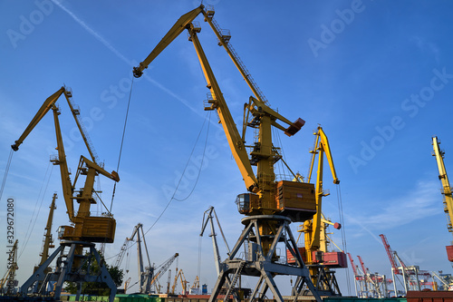 Wallpaper Mural Harbor cranes in backlight. Port cranes at industrial sea port Torontodigital.ca