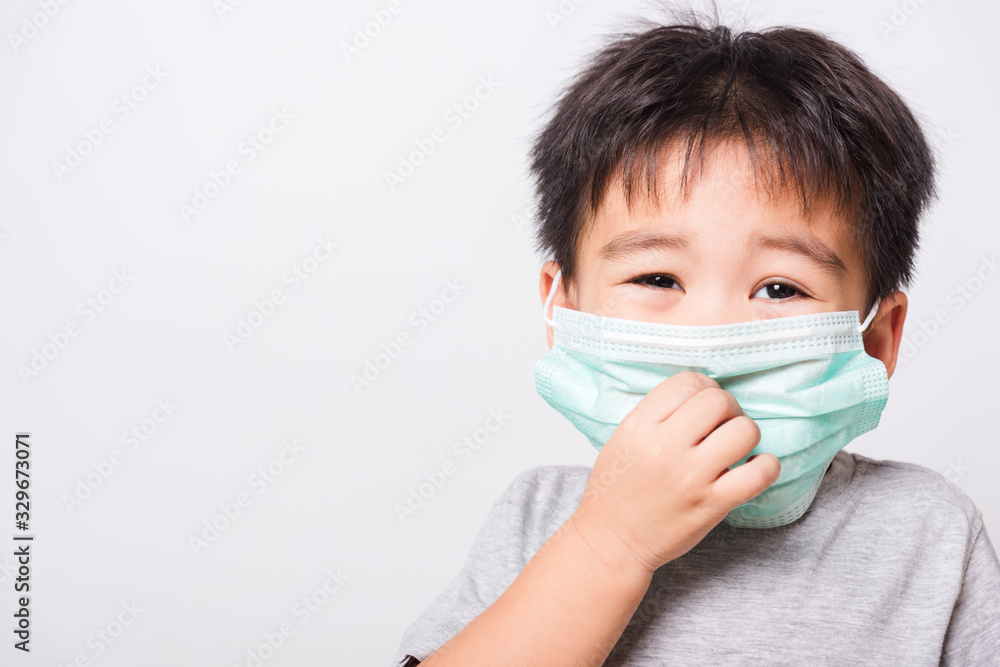 Closeup Asian face, Little children boy sick he using medicine healthcare mask Closeup Asian face, Little children boy sick he using medicine healthcare mask