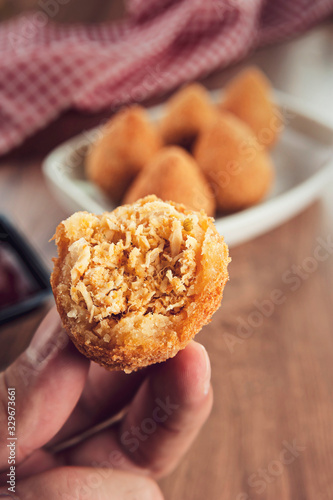 Coxinha de frango (Brazilian appetiser stuffed with chicken) in close up