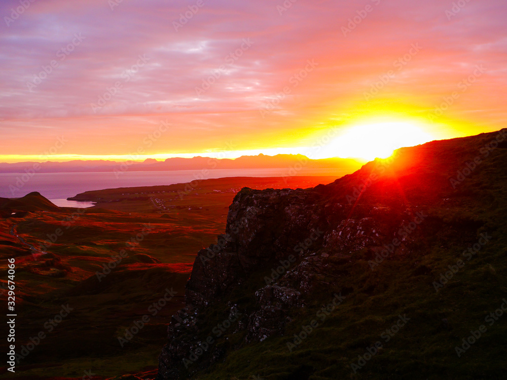 View of the rising sun at Quiraing viewpoint in very early morning light
