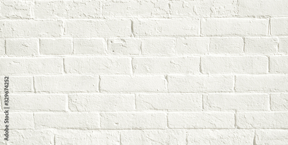 White brick wall background. Neutral texture of a flat brick wall close-up. White brick wall background. Neutral texture of a flat brick wall close-up.