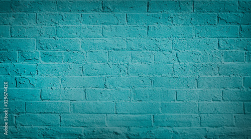 Blue teal brick wall background. Neutral texture of a flat brick wall close-up. photo