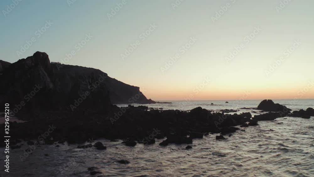 Magical aerial view of cliffs at sunset/sunrise on the coast of Portugal. Breathtaking nature and landscape for meditation and yoga. Summer paradise. Magical aerial view of cliffs at sunset/sunrise on the coast of Portugal. Breathtaking nature and landscape for meditation and yoga. Summer paradise.
