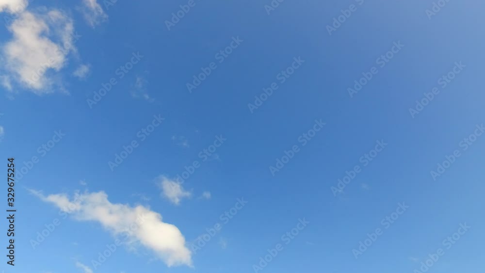 Peaceful sky texture with overhanging white clouds on blue background, feeling free concept, copy-space Peaceful sky texture with overhanging white clouds on blue background, feeling free concept, copy-space