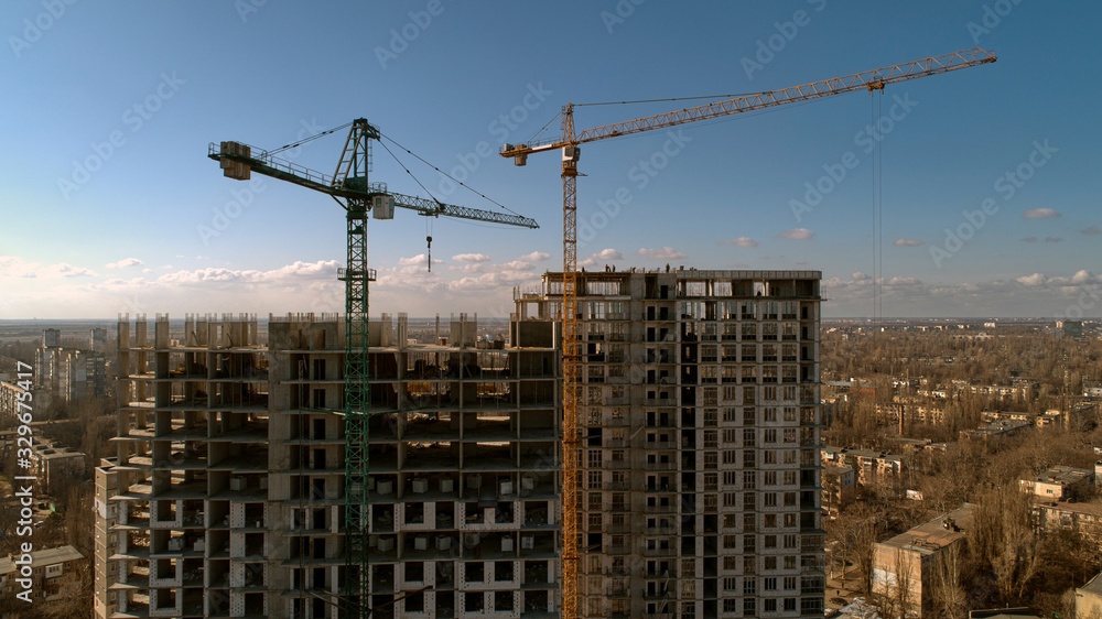 Construction of high-rise residential building. Aerial view of construction of high-rise apartment building.