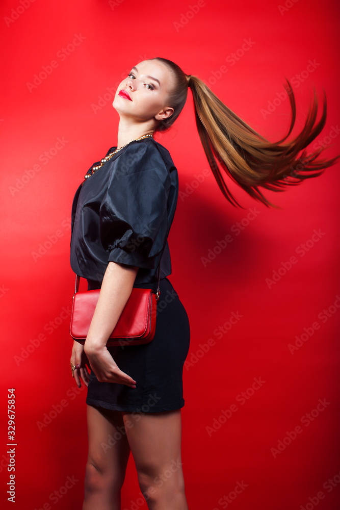 young pretty woman young lady posing on red background, lifestyle people concept young pretty woman young lady posing on red background, lifestyle people concept