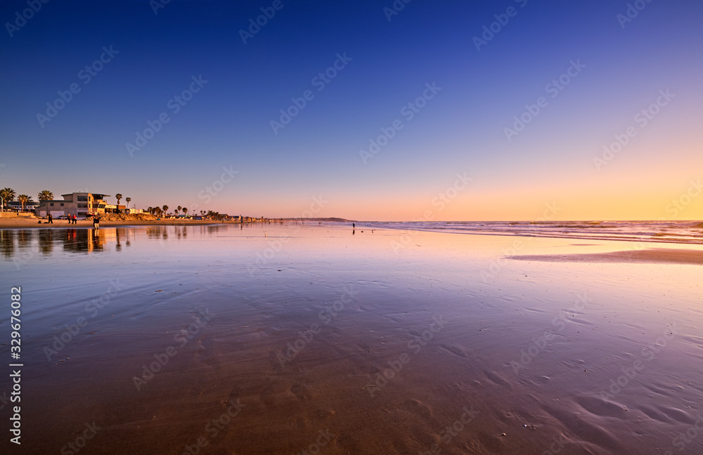 View South on Pacific Beach towards Mission Beach at low tide on a sunny Winter evening