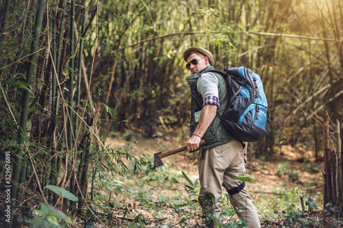 Young man traveler and backpack hiking outdoors