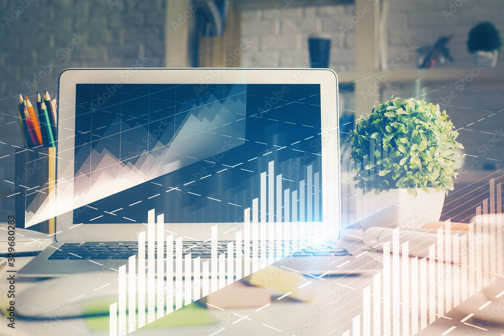 Financial market graph hologram and personal computer on background. Multi exposure. Concept of forex.