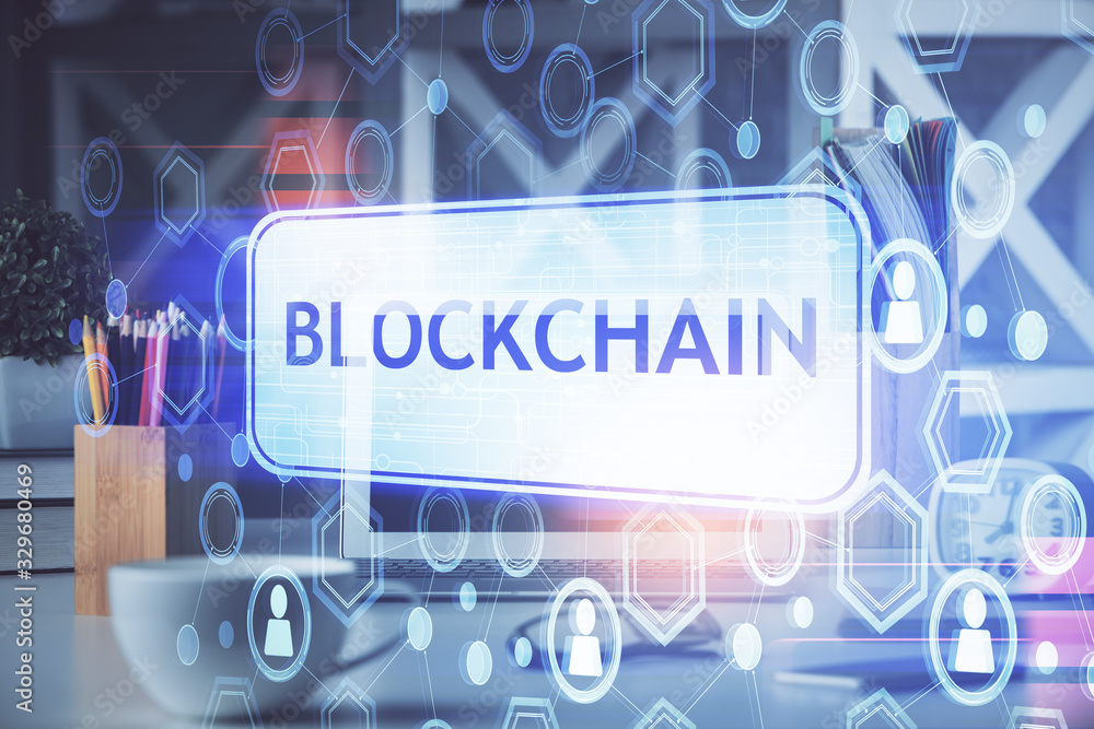 Multi exposure of blockchain and crypto economy theme hologram and table with computer background. Concept of bitcoin cryptocurrency. Multi exposure of blockchain and crypto economy theme hologram and table with computer background. Concept of bitcoin cryptocurrency.