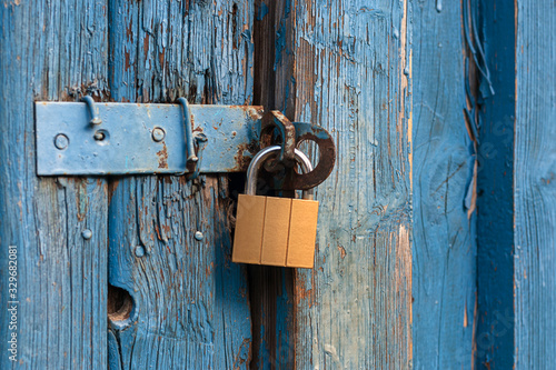 old door locked with new padlock