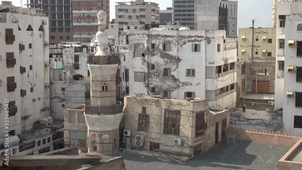 Classic minaret of mosque inside the historic Al Balad neighborhood, the old city center of Jeddah in Saudi Arabia Classic minaret of mosque inside the historic Al Balad neighborhood, the old city center of Jeddah in Saudi Arabia