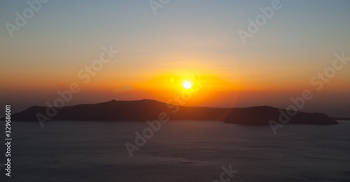 Sunset Over Island From Santorini Greece