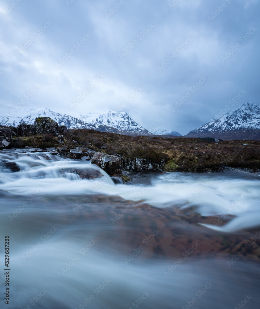 the river coupall waterfalls on rannoch moor showing buachaille etive mor in the background as the entrance to glencoe valley in winter the river coupall waterfalls on rannoch moor showing buachaille etive mor in the background as the entrance to glencoe valley in winter