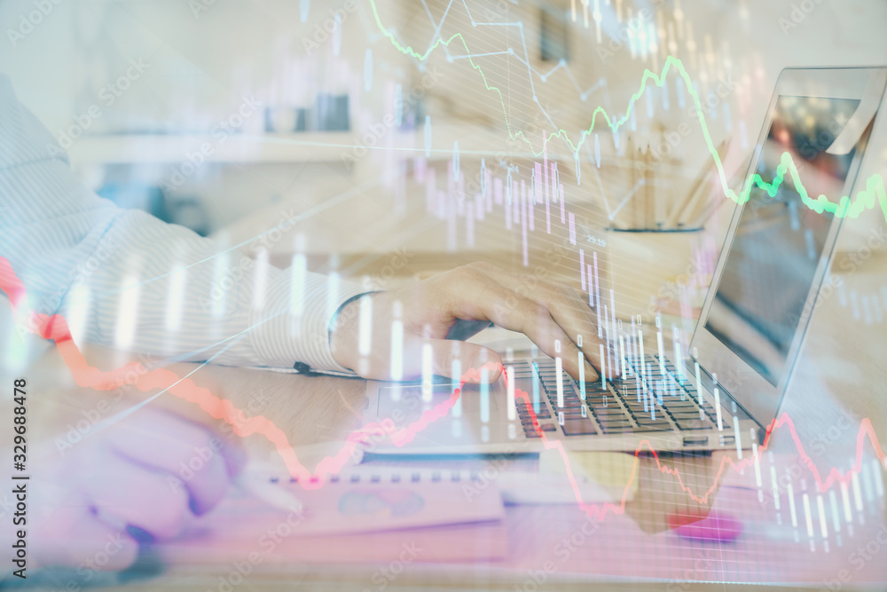 Multi exposure of stock market graph with man working on laptop on background. Concept of financial analysis. Multi exposure of stock market graph with man working on laptop on background. Concept of financial analysis.