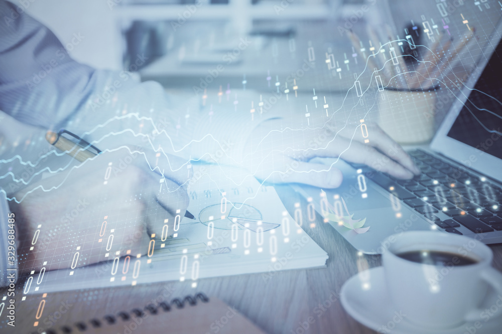 Multi exposure of stock market graph with man working on laptop on background. Concept of financial analysis. Multi exposure of stock market graph with man working on laptop on background. Concept of financial analysis.