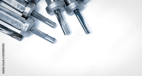 Special tools isolated on white background. Made to order special tools. Coated step drill and reamer detail. HSS cemented carbide. Carbide cutting tool for industrial applications. Engineering tools.