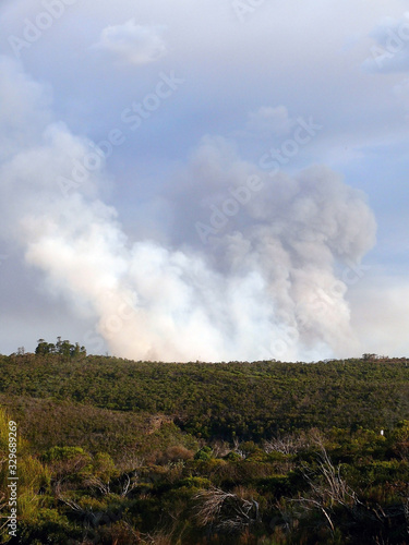 A view of bushfire smoke burning on a ridge at Wentworth Falls in the Blue Mountains west of Sydney