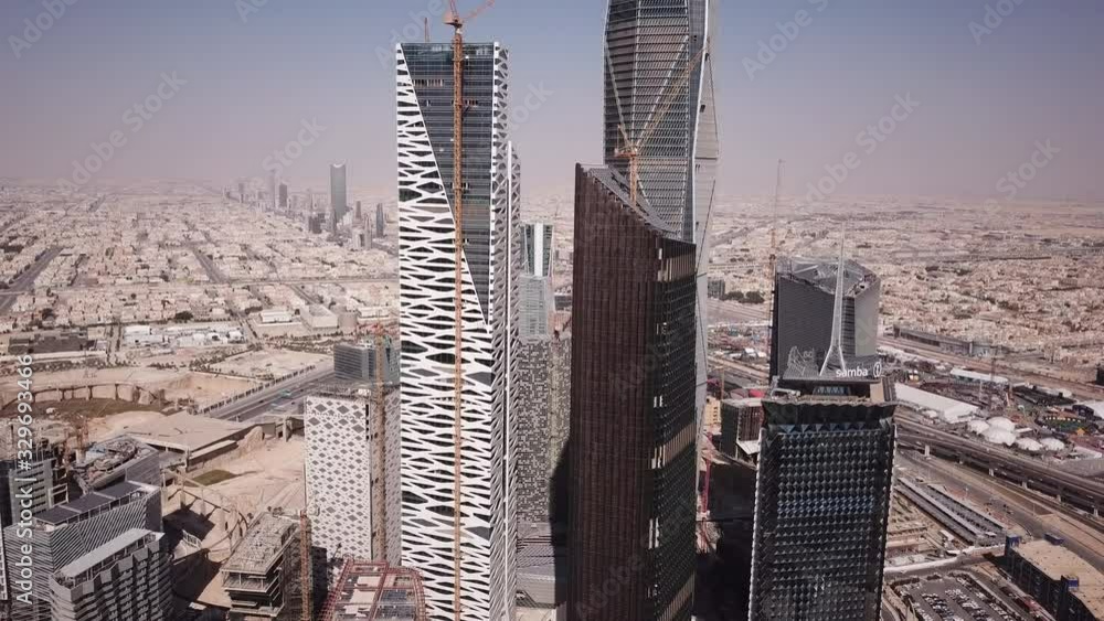 Ascending drone shot of new skyscrapers and modern office towers ...