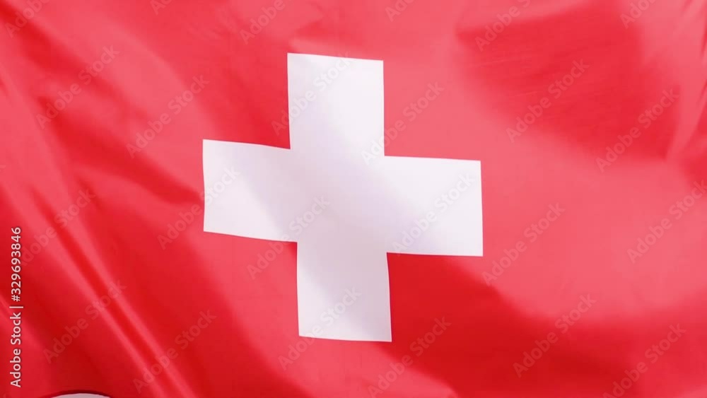 Closeup of Swiss flag waving in wind in slow motion. Closeup of Swiss flag waving in wind in slow motion.