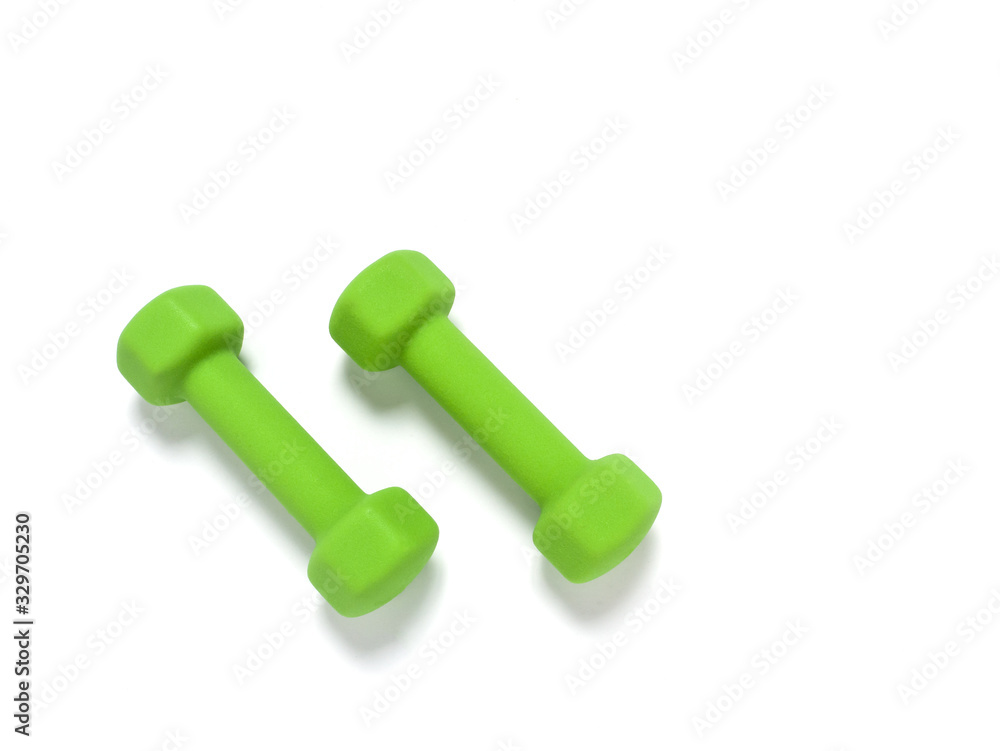 Two green dumbbells on white background. Two green dumbbells on white background.