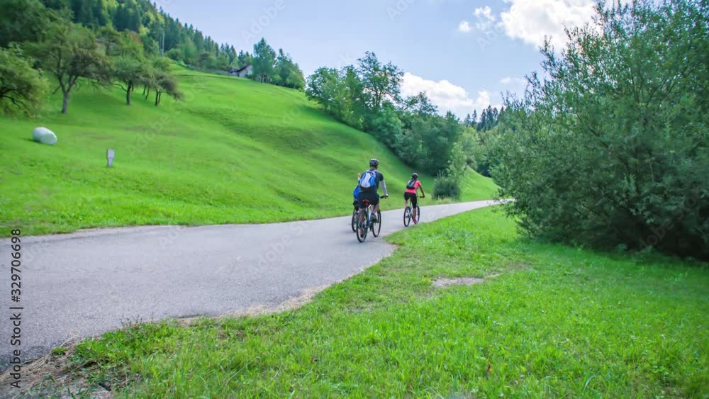 Healthy family ride bikes at park in Slovenj Gradec , Slovenia, tracking Healthy family ride bikes at park in Slovenj Gradec , Slovenia, tracking