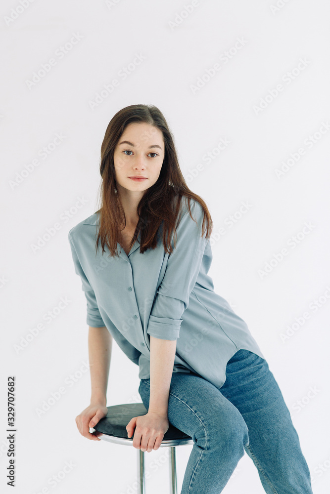 Professional model and pose at the cyclorama. Model tests of a girl in a Studio with a white background. Professional model and pose at the cyclorama. Model tests of a girl in a Studio with a white background.
