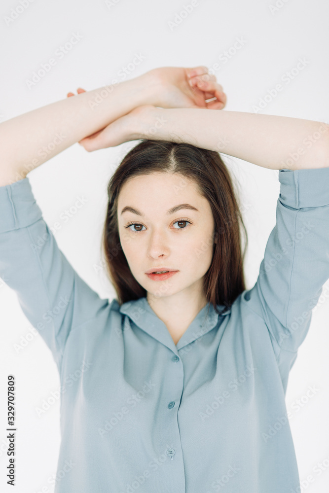 Professional model and pose at the cyclorama. Model tests of a girl in a Studio with a white background. Professional model and pose at the cyclorama. Model tests of a girl in a Studio with a white background.