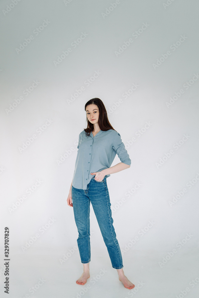 Professional model and pose at the cyclorama. Model tests of a girl in a Studio with a white background. Professional model and pose at the cyclorama. Model tests of a girl in a Studio with a white background.