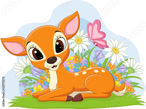 Cute deer laying in the grass