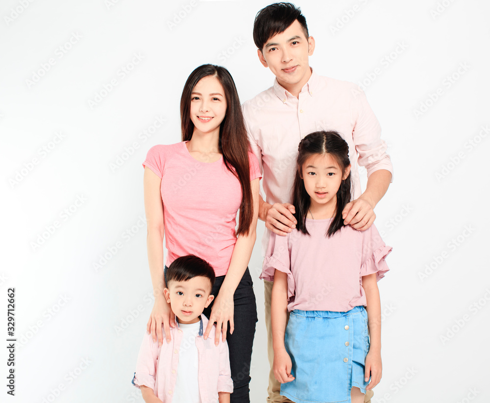 happy young asian family standing before white background happy young asian family standing before white background