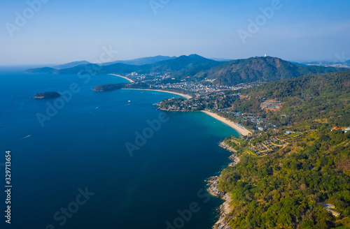 Fototapeta Naklejka Na Ścianę i Meble -  Aerial view of the coastline of Phuket island with tropical sandy beaches and mountains at sunny day, Thailand