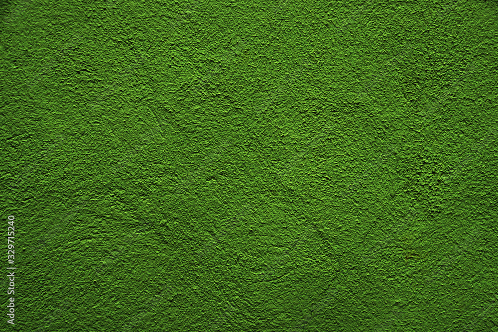 Green shiny background. Green uneven color. A sheet of dark green crumpled paper with natural light. Fragment of a crumpled sheet of green paper with highlights Green shiny background. Green uneven color. A sheet of dark green crumpled paper with natural light. Fragment of a crumpled sheet of green paper with highlights