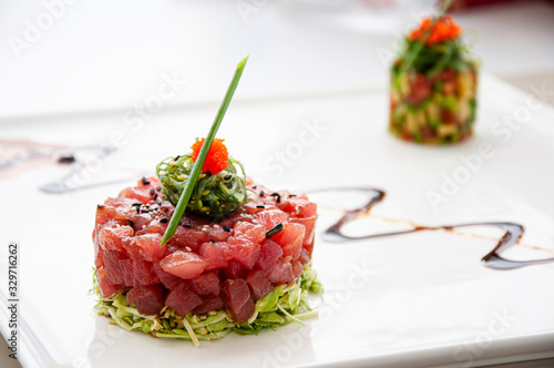 Fresh Tuna tartare sesame seaweed and green salad and balsamic reduction sauce and salsa