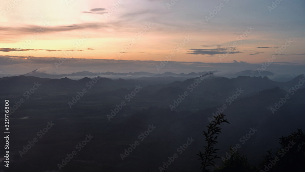 Obraz premium Landscape view background with orange sunrise