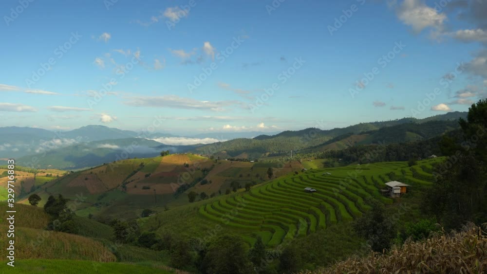 Nature landscape beautiful green rice field terrace on background mountain with scenery clouds and blue sky at sunrise. Nature landscape beautiful green rice field terrace on background mountain with scenery clouds and blue sky at sunrise.