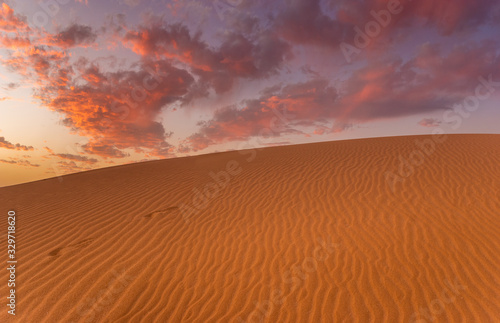 wonderful, dramatic sky over the sandy desert after sunset