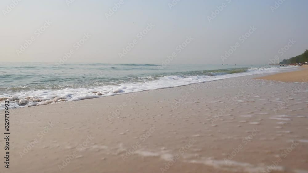 Water wave flowing back from the beautiful sand beach in Thailand, Asia. Travel vacation in summer season on tropical sea beach. Relaxation, holiday, nature background concepts. Water wave flowing back from the beautiful sand beach in Thailand, Asia. Travel vacation in summer season on tropical sea beach. Relaxation, holiday, nature background concepts.