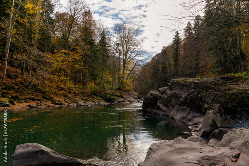 Clean mountain river in the autumn forest.