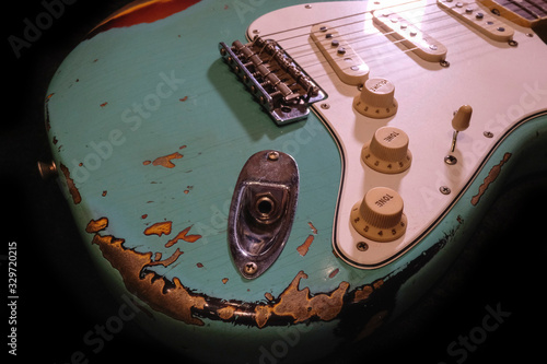 close up detail of electric guitar Body heavy Relic with selective focus.