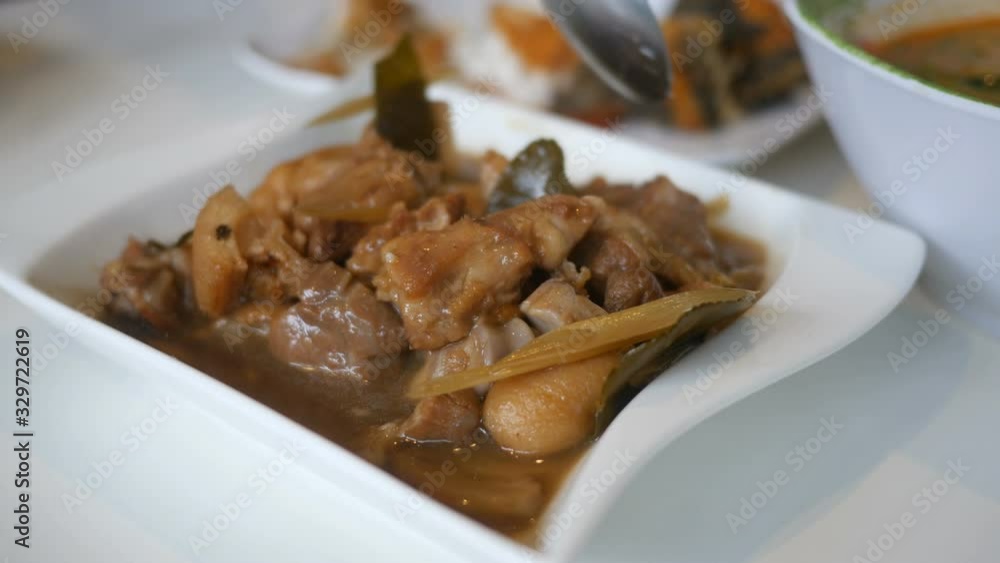 stewed pork knuckle with herb , vietnamese style food stewed pork knuckle with herb , vietnamese style food